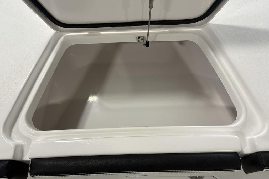 Open storage compartment in 2026 Tidewater 2300 Carolina Bay boat.