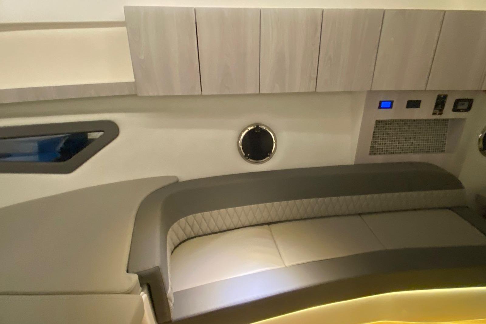 Luxurious interior of 2026 Hanover 375 with modern seating and sleek cabinetry.