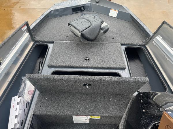 2025 Crestliner XF 179 boat interior with storage compartments and seating.