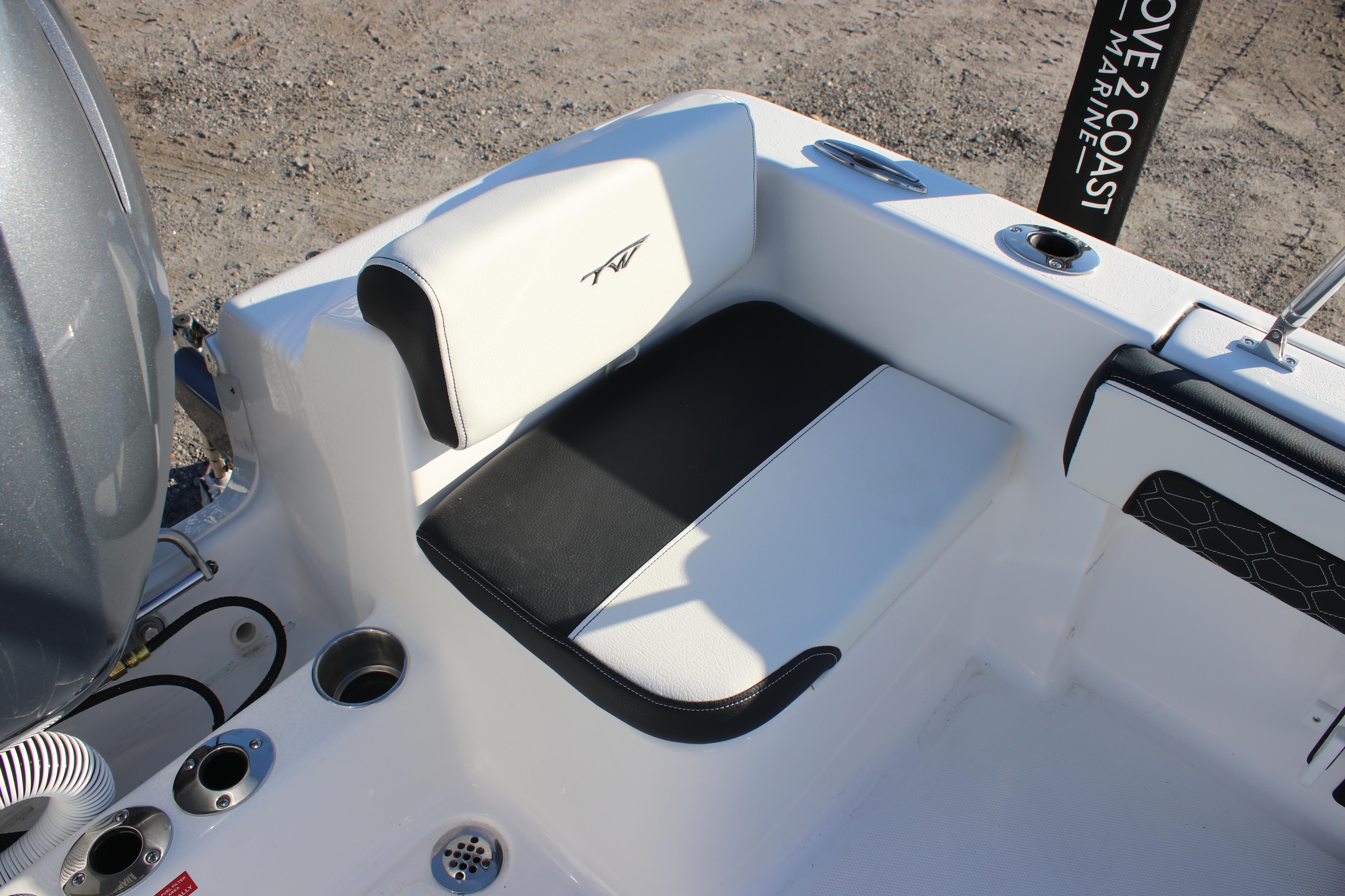 2026 Tidewater 180 CC Adventure boat seating area with black and white upholstery.