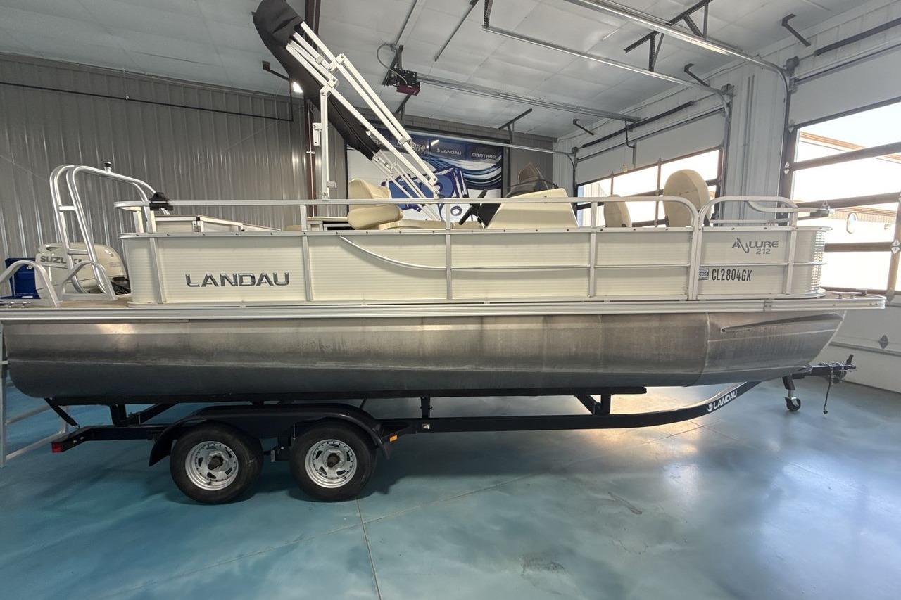2018 Landau Alure 212 Fish pontoon boat on trailer in indoor storage.