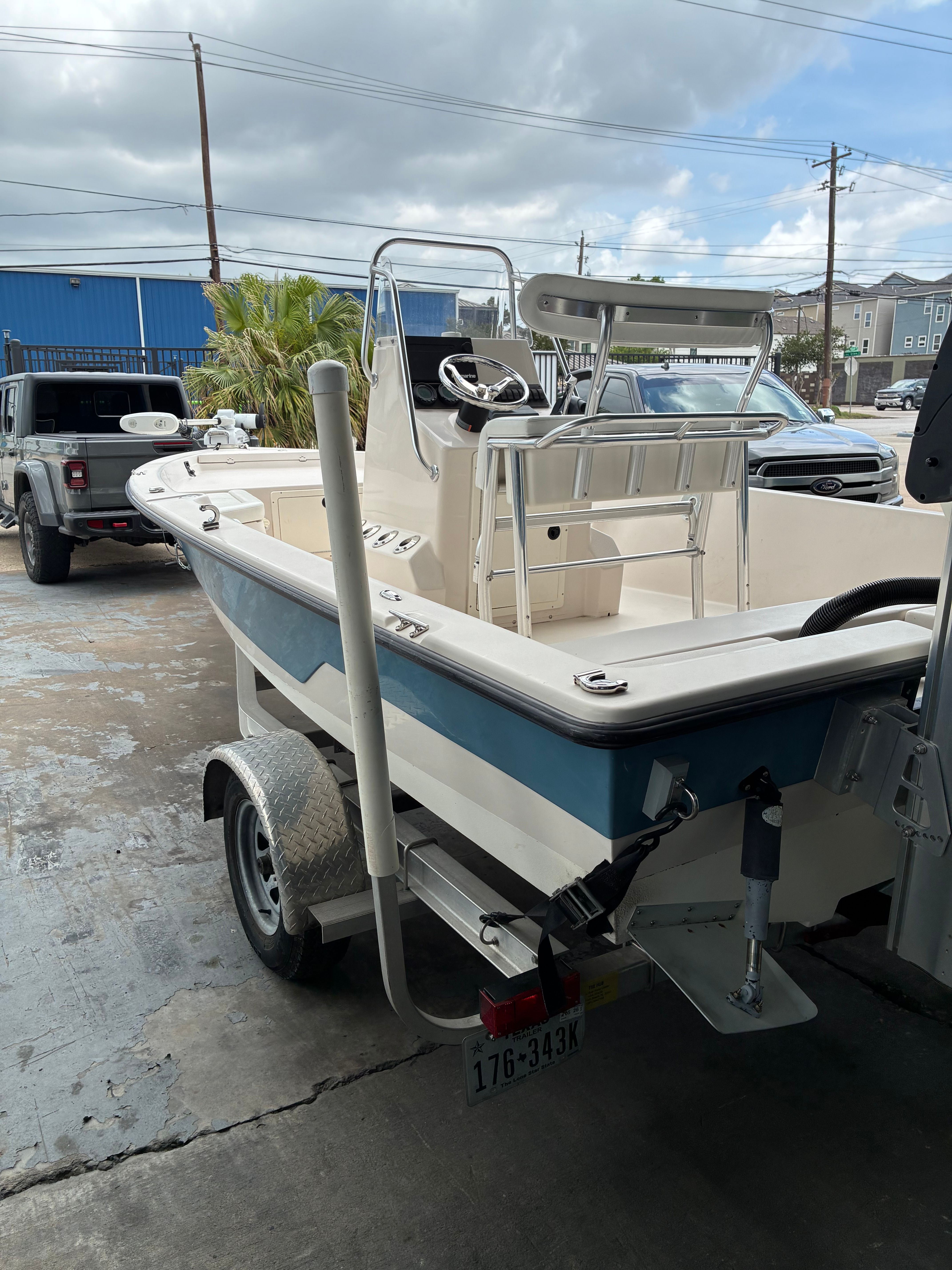 2016 Pathfinder Fishing boat on trailer parked outdoors.