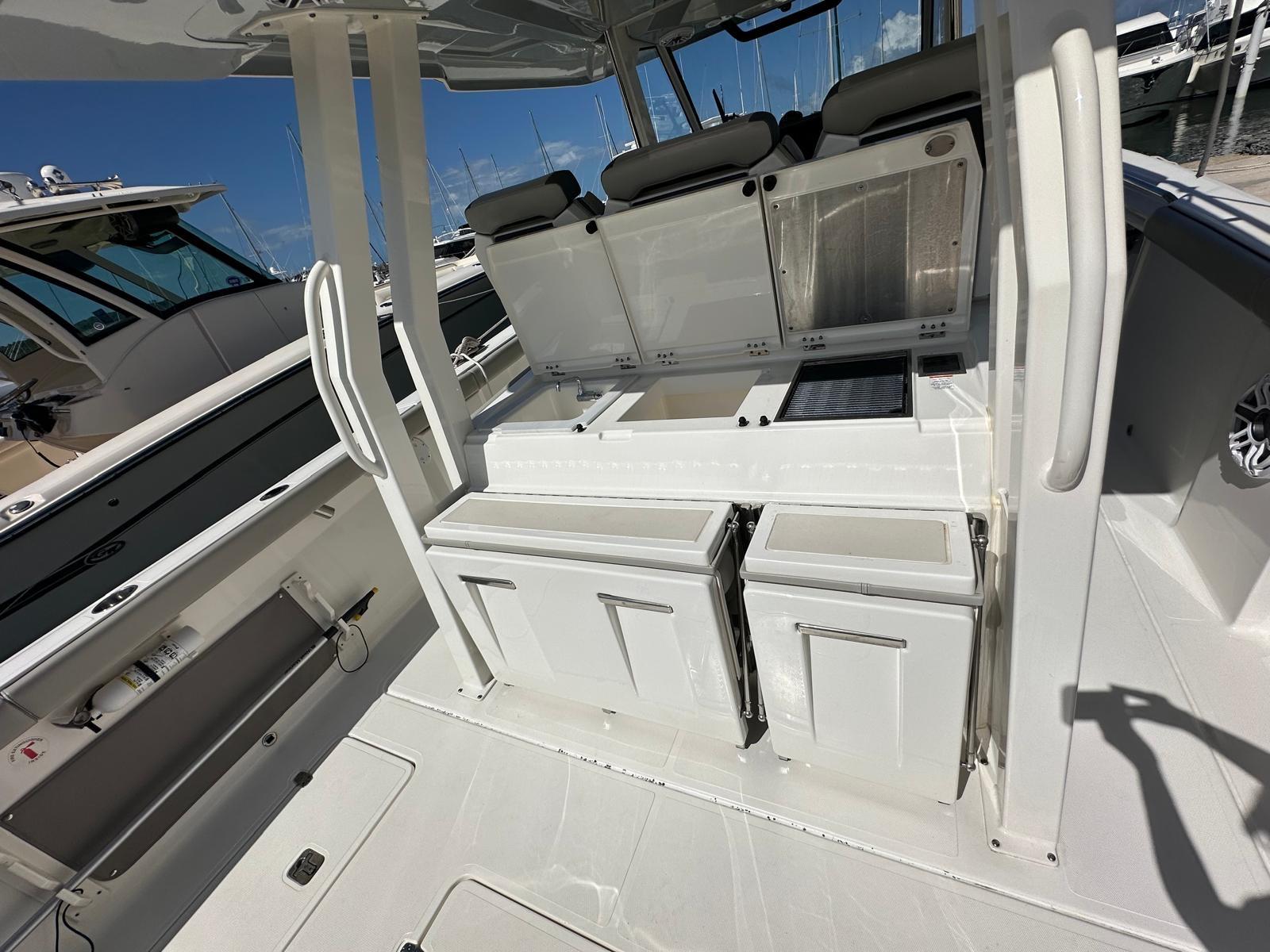 2023 Pursuit S 358 Sport boat interior with seating and storage compartments.