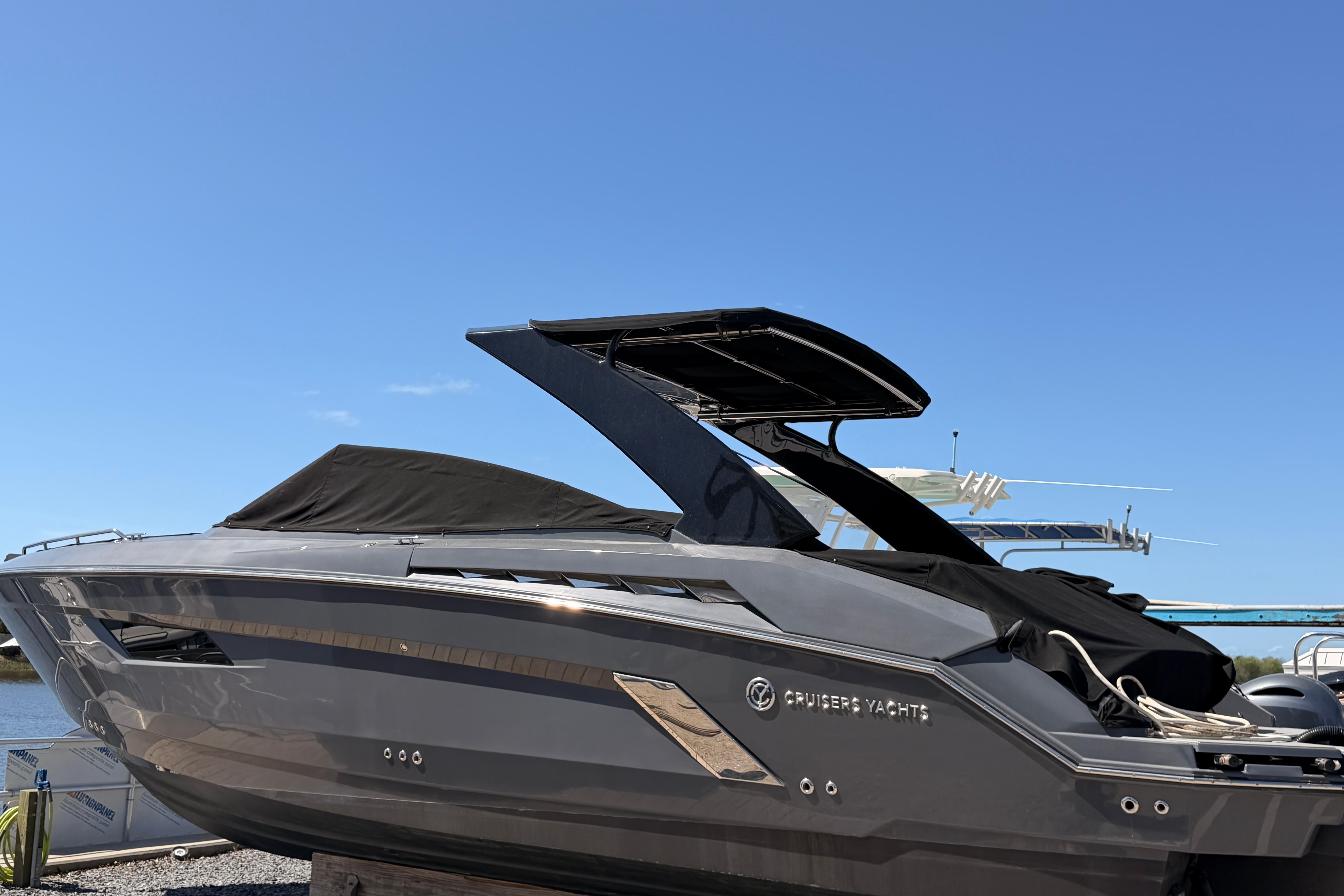 2021 Cruisers Yachts 338 Bow Rider under clear blue sky.