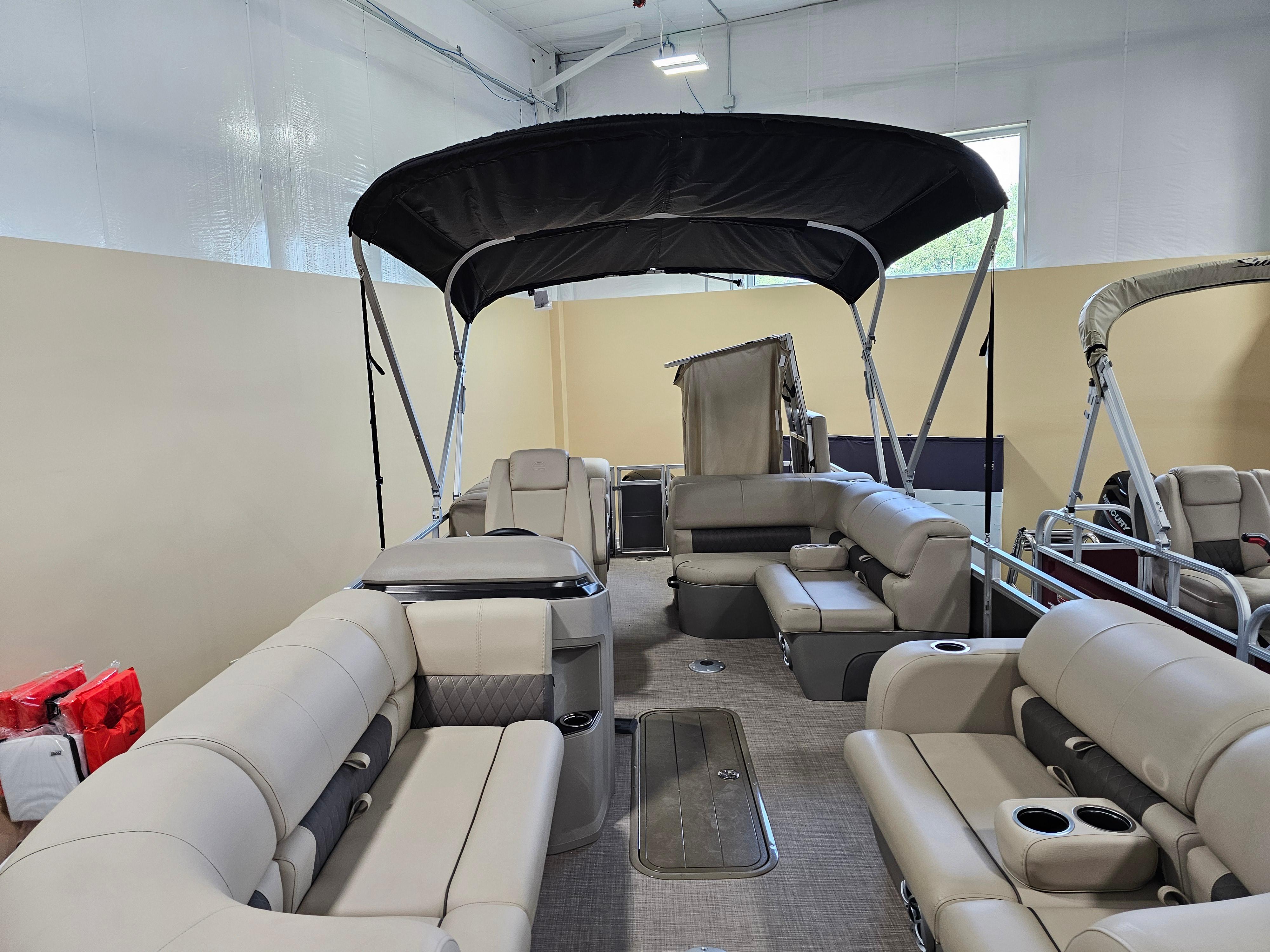 2024 Sun Tracker Party Barge 22 RF XP3 pontoon boat with spacious seating and canopy.