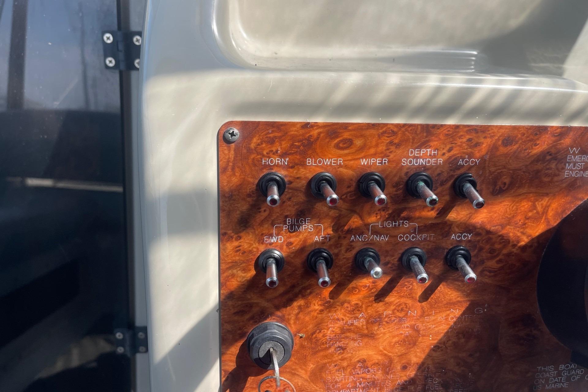 Control panel of a 1997 Bayliner 2655 Ciera boat with various switches.