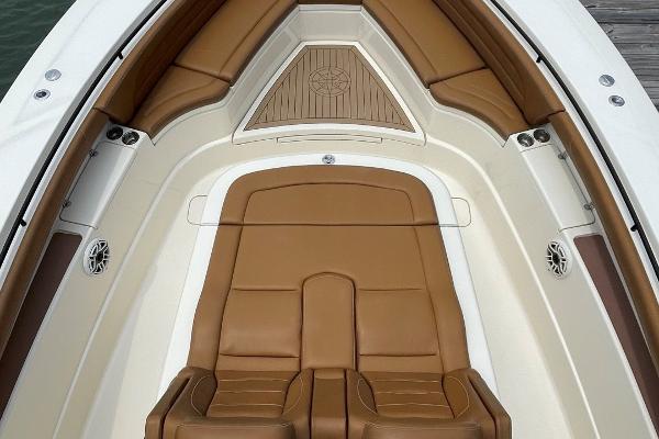 Luxurious interior of 2020 Scout 420 LXF boat with tan leather seating.