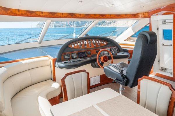 Luxurious 2023 Massimo Marine Sunbird yacht interior with elegant seating and modern helm.