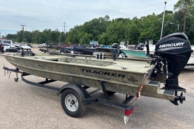 2017 Tracker Grizzly 1654 MVX Sportsman boat on trailer with Mercury outboard motor.