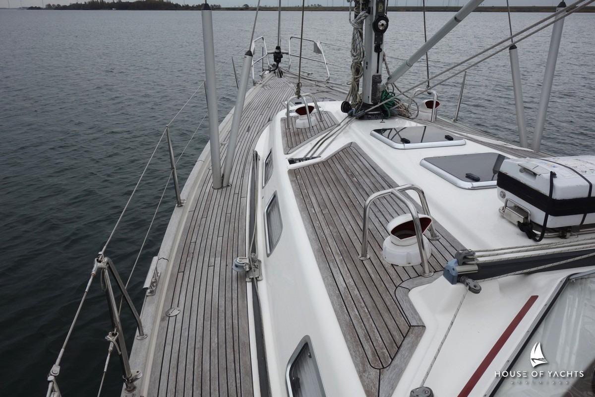2007 Najad 440 AC sailboat deck with teak finish on calm water.