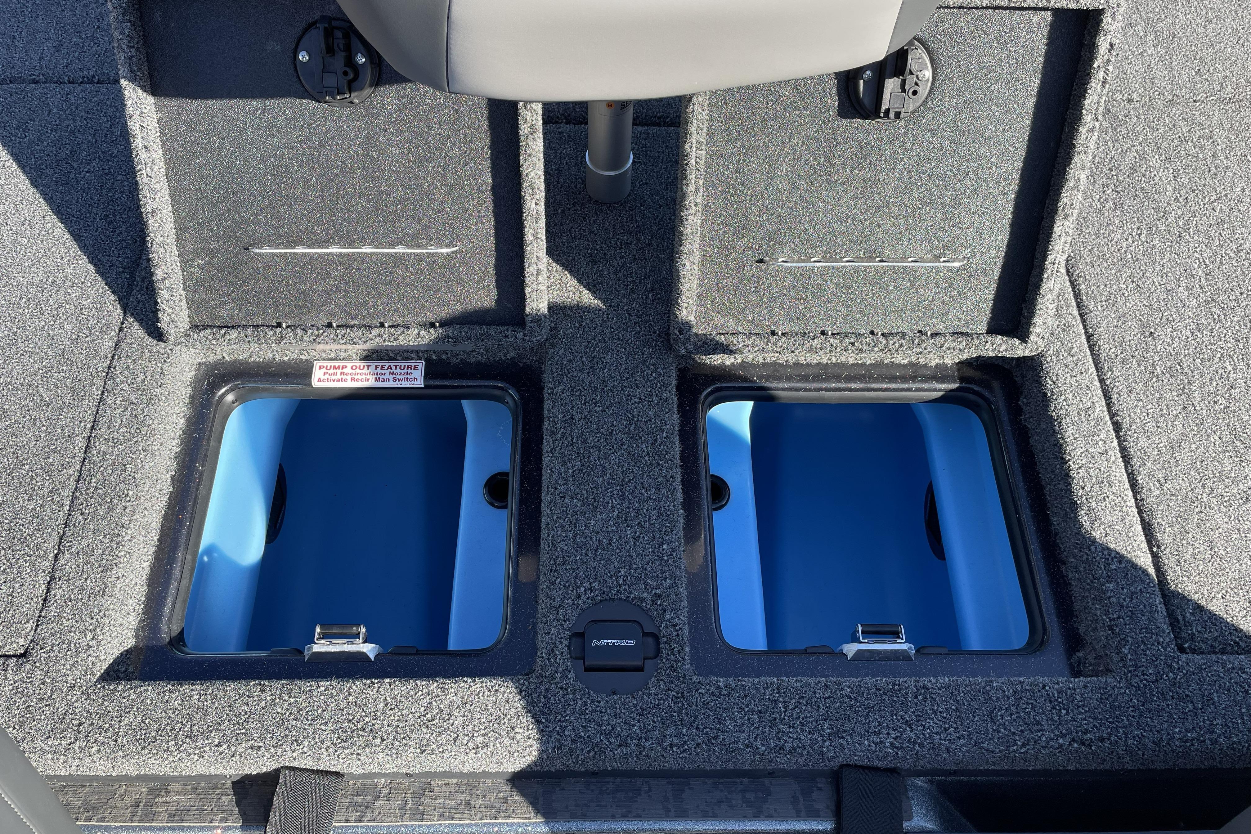 2026 Nitro Z20 XL boat storage compartments with blue interior and pump-out feature.