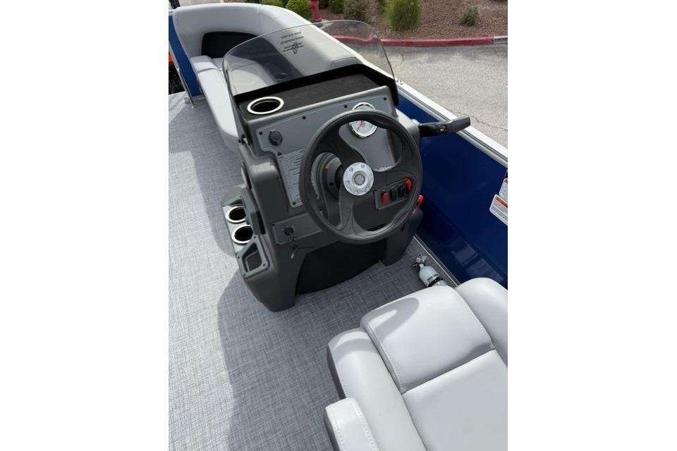 2026 Sun Tracker Party Barge 16 DLX steering console with modern controls and seating.