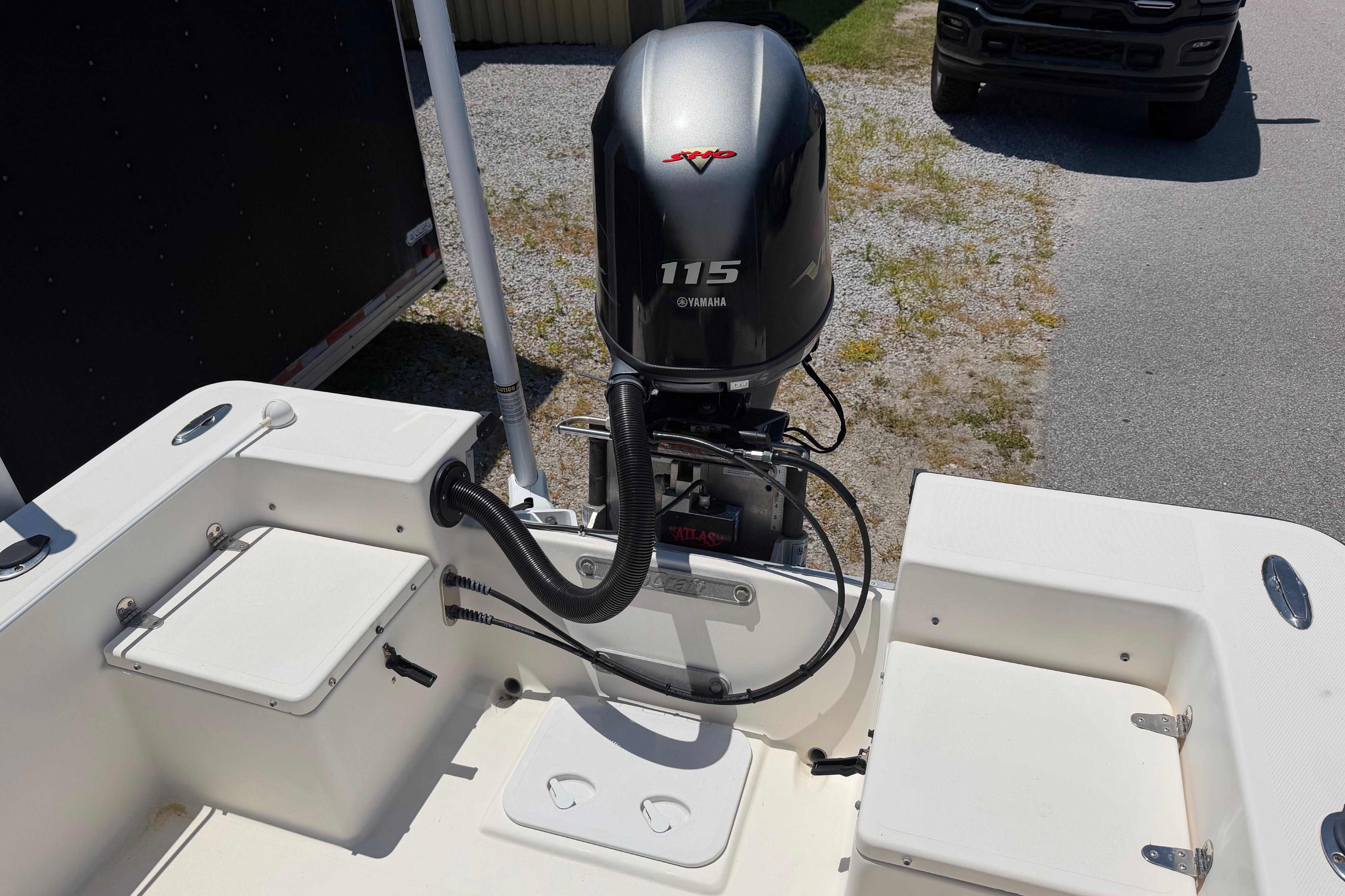 2008 KenCraft Bay Rider 2060 boat with Yamaha 115 outboard motor, parked on gravel.