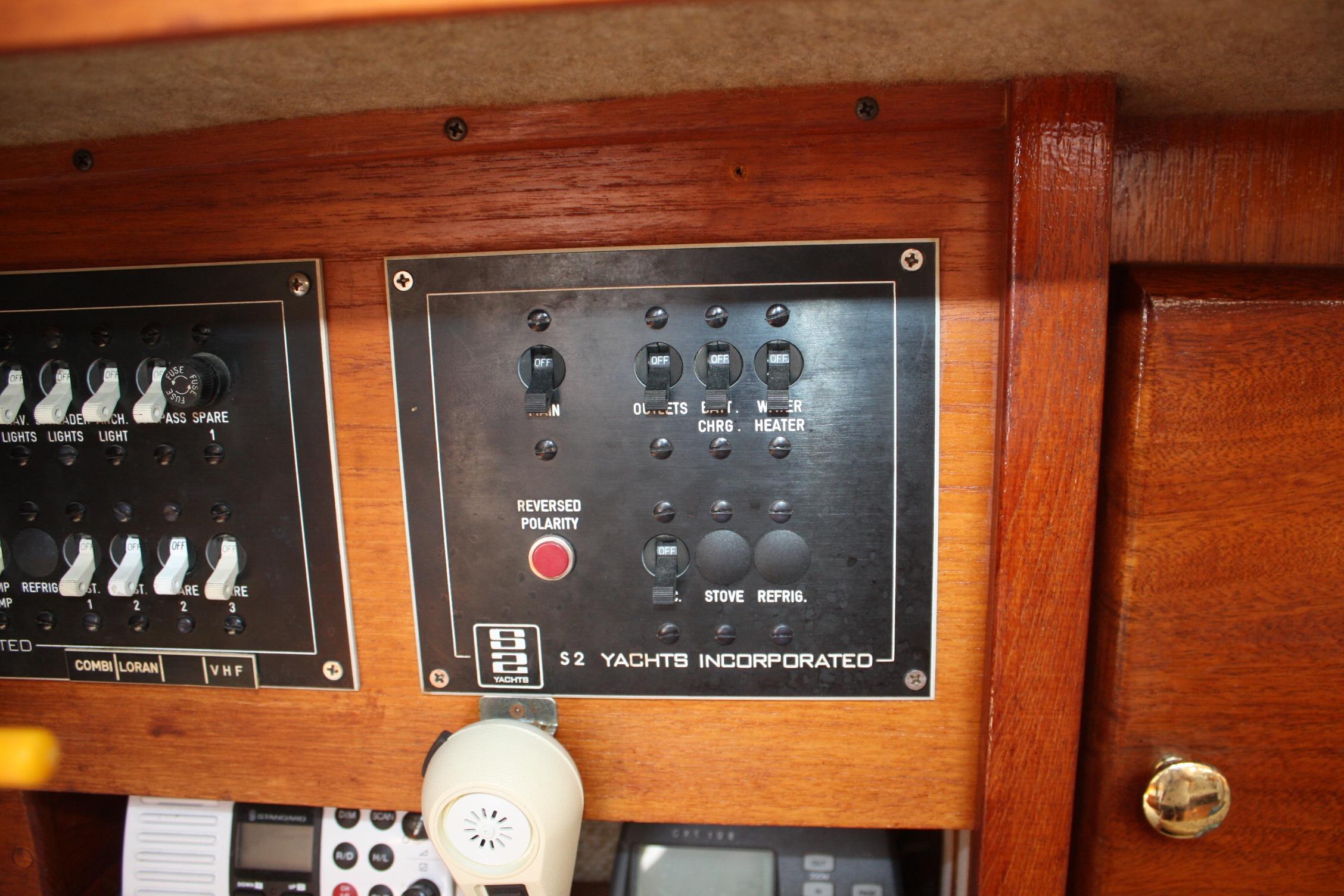 Electrical panel of a 1981 S2 9.2A yacht, featuring switches and controls.
