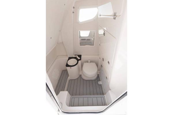 Manufacturer Provided Image: 2025 Sea Fox 268 Commander boat interior bathroom with toilet and storage.