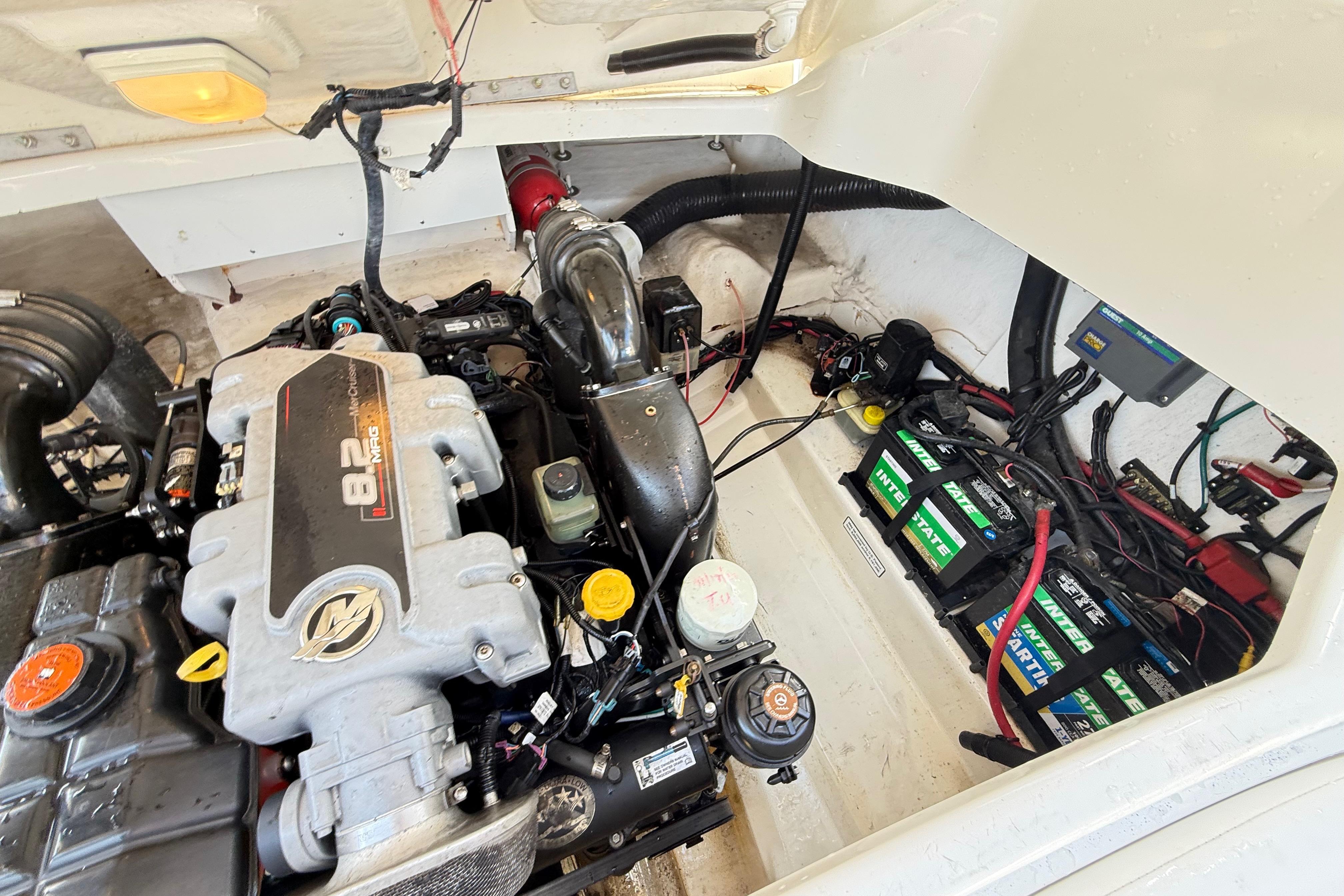 Engine compartment of a 2011 Sea Ray 270 SLX boat, featuring an 8.2L V8 engine.