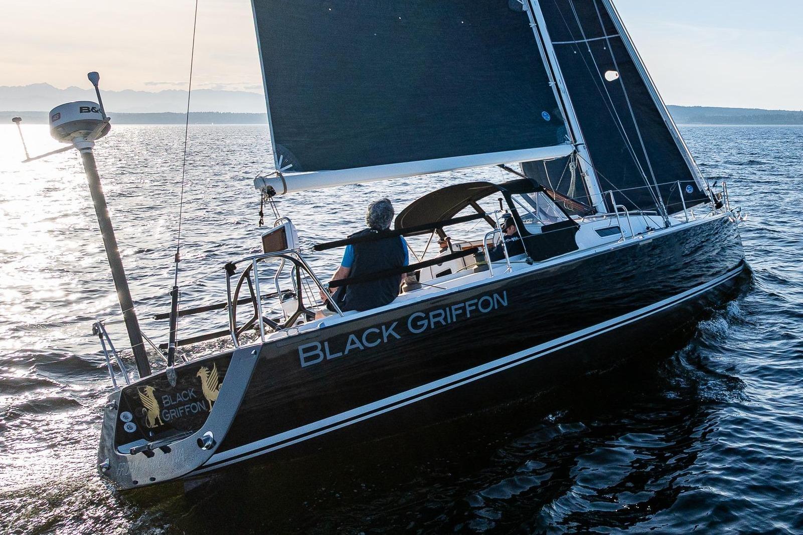 Sailing yacht "Black Griffon," a 2007 J Boats J/124, gliding on open water.