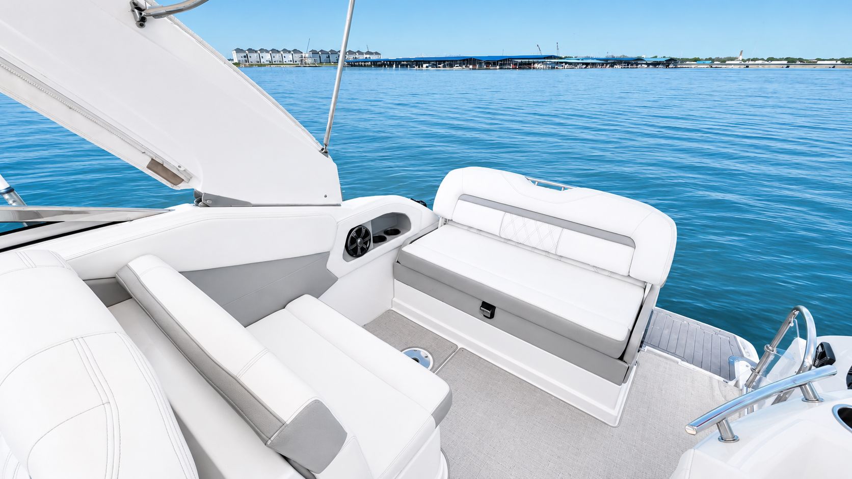 The image shows the cockpit of a 2020 Regal 28 Express boat on calm water.