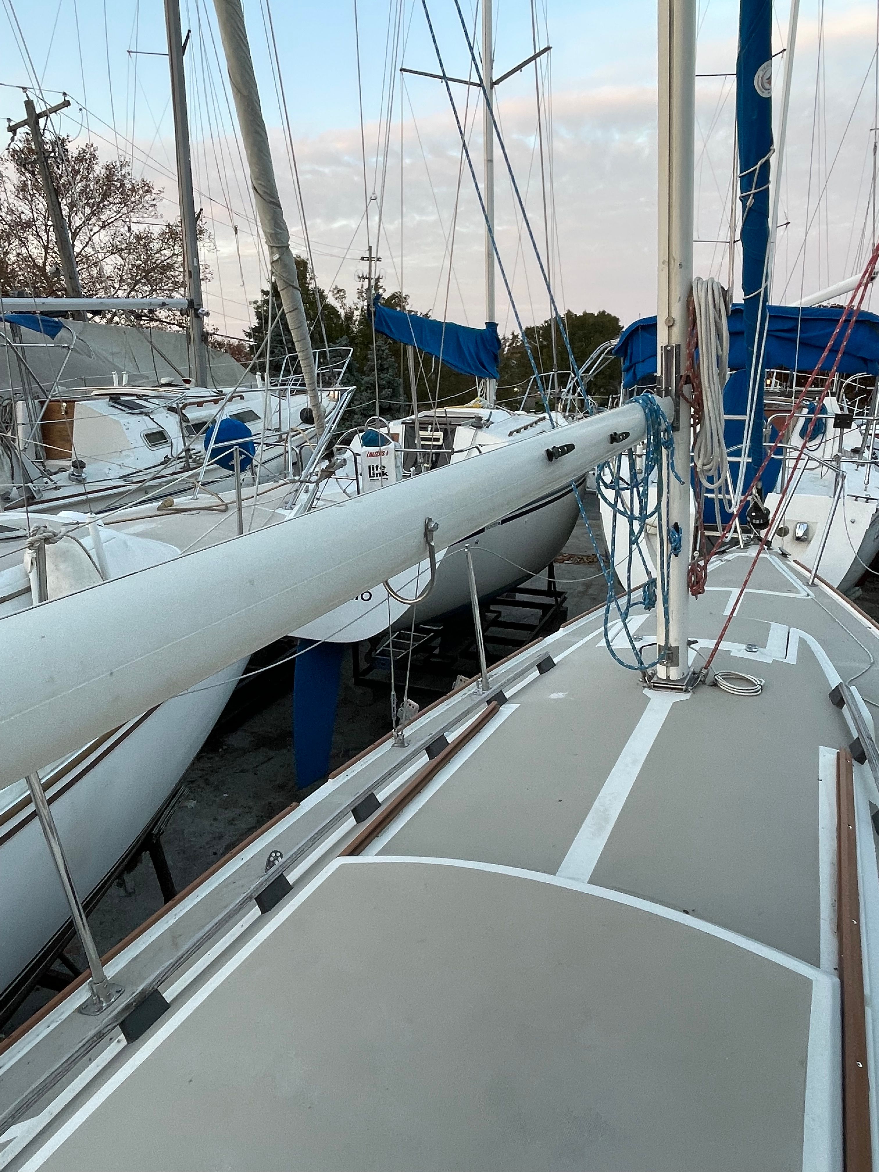 1984 O'Day 25 sailboat in harbor, mast and deck view.