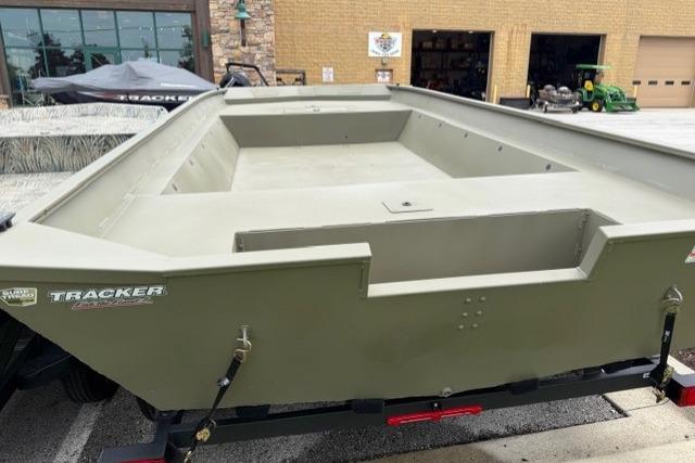 2026 Tracker Grizzly 2072 Utility boat on trailer, displayed outdoors.