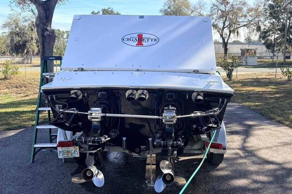 1983 Cigarette 24' Classic boat rear view with dual propellers and logo.