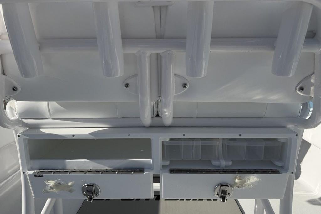 2026 Sportsman Masters 247OE Bay Boat storage compartments and rod holders.