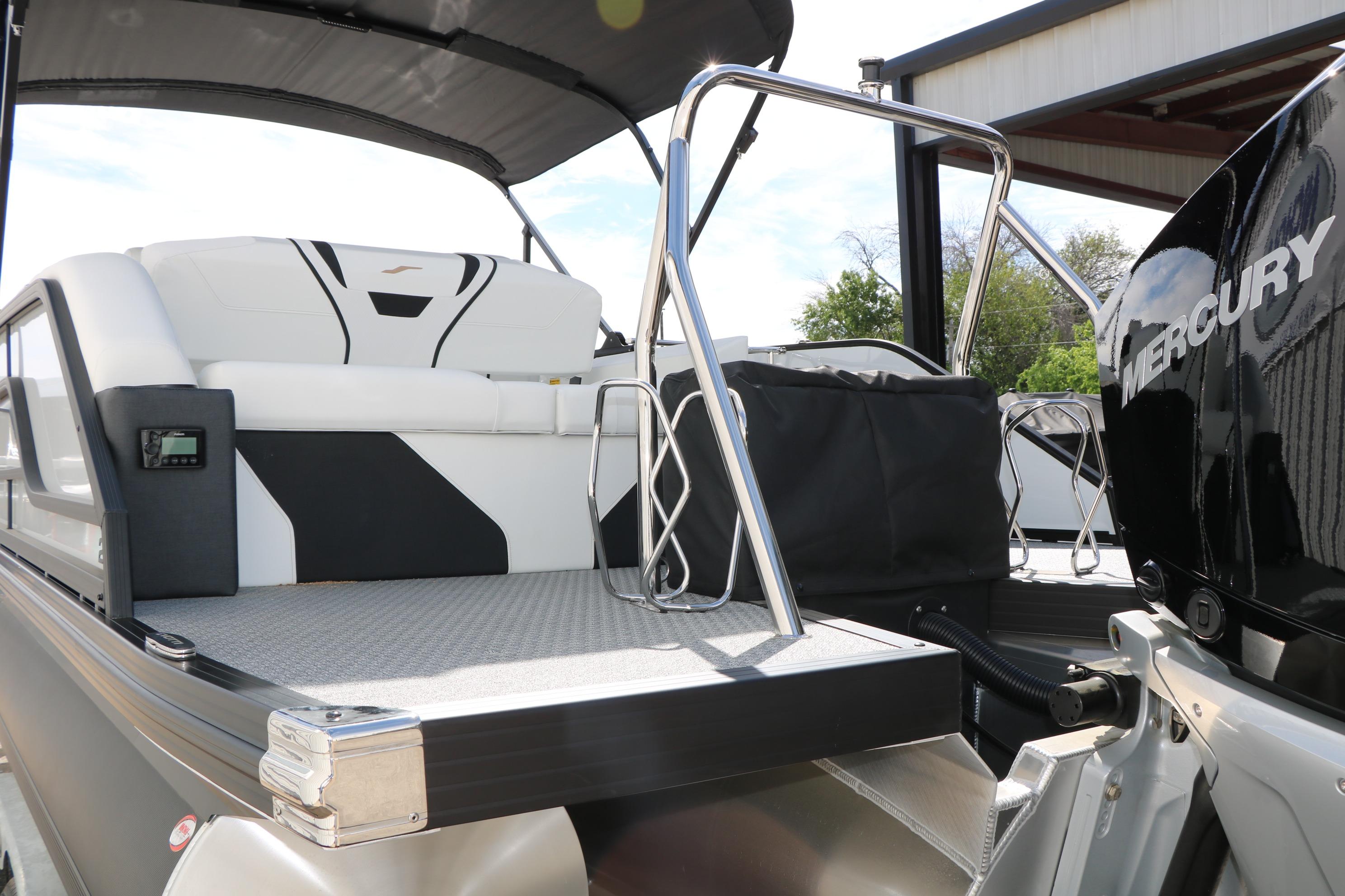 2026 Evotti 725 CS Tri-Toon boat with Mercury engine, featuring sleek seating and modern design.