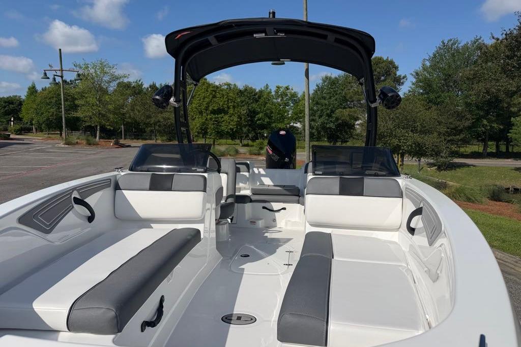 2026 Tahoe T21 boat with sleek seating and modern design in a scenic outdoor setting.