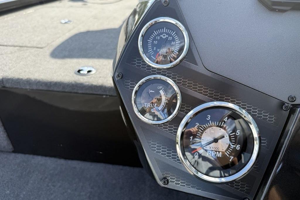 Dashboard of 2023 Vexus AVX189 boat with gauges for water pressure, trim, and RPM.