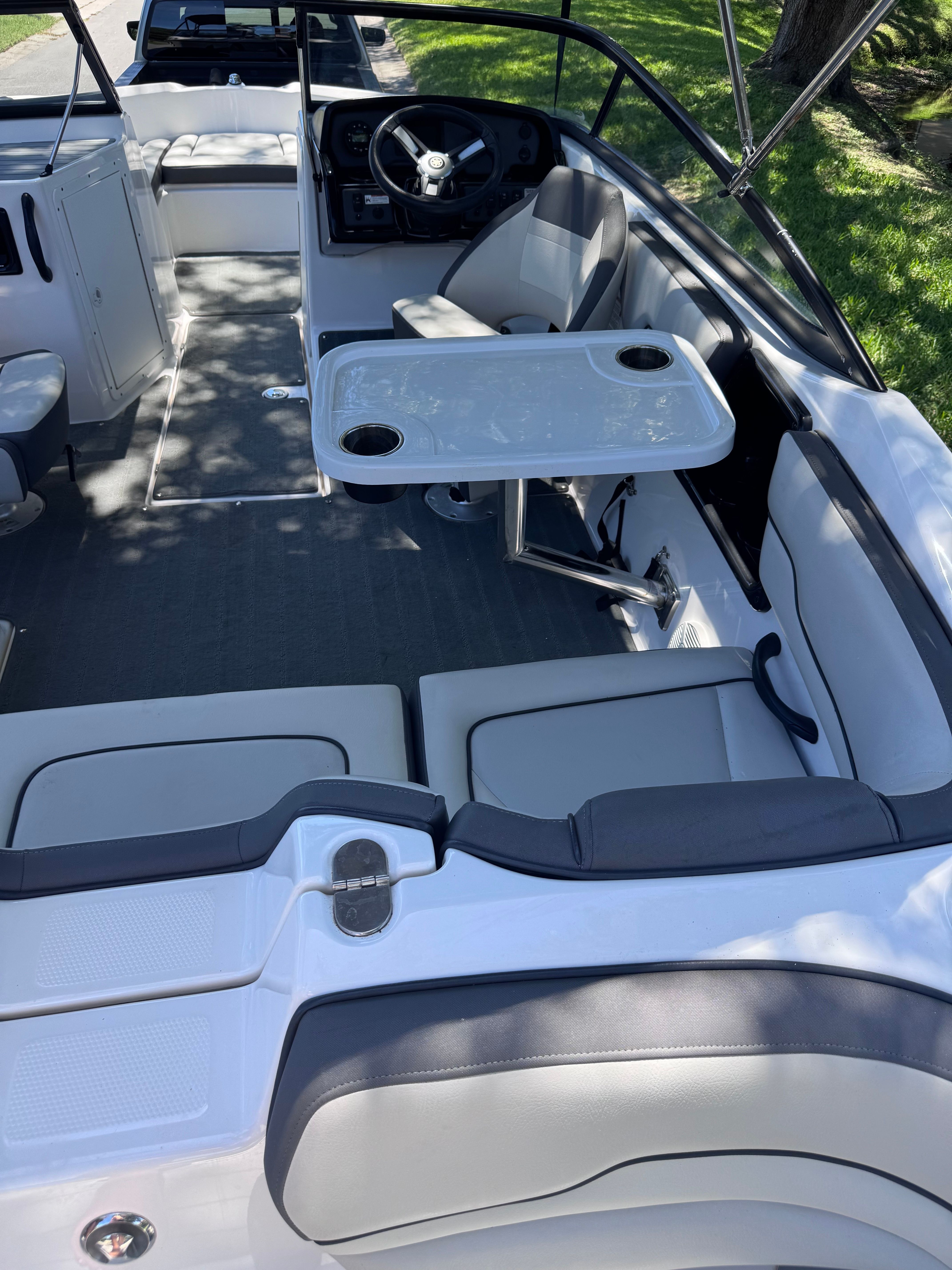 Interior of a 2020 Yamaha SX190 boat with table and seating.