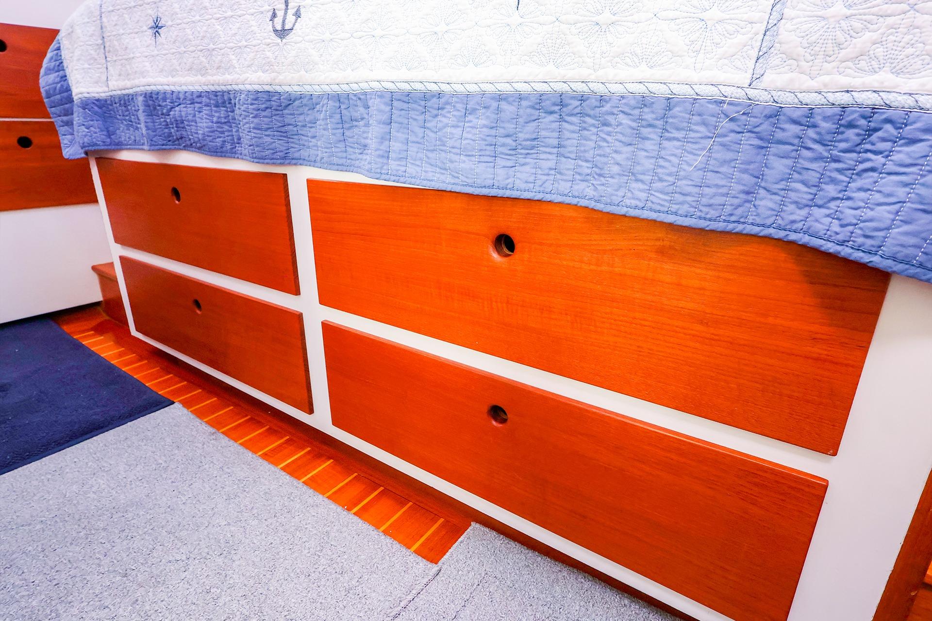 Wooden drawers in a 2005 New England Boatworks Downeast Sedan interior.