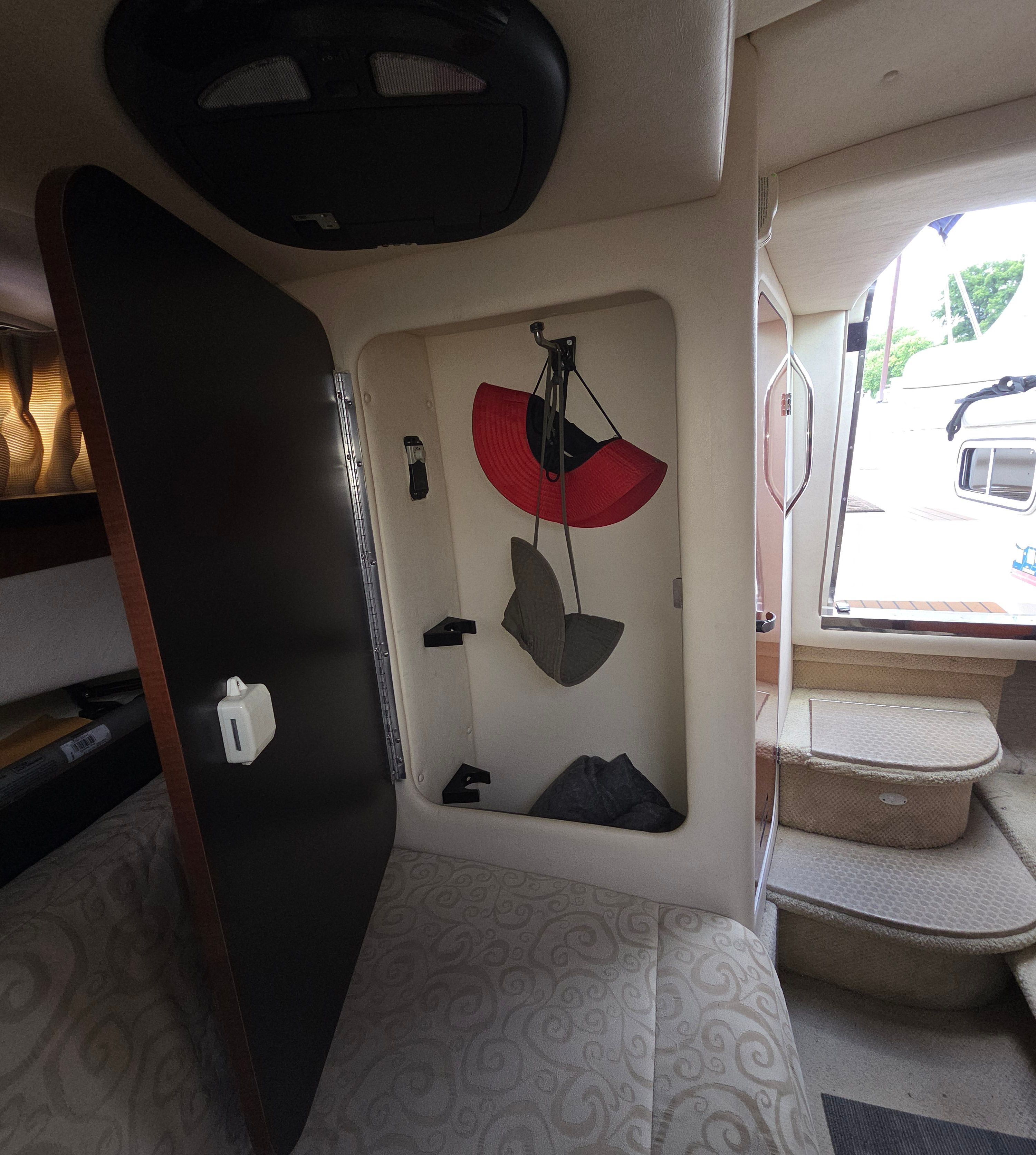 Interior of the 2005 Sea Ray Sundancer 260 with storage and stairs.
