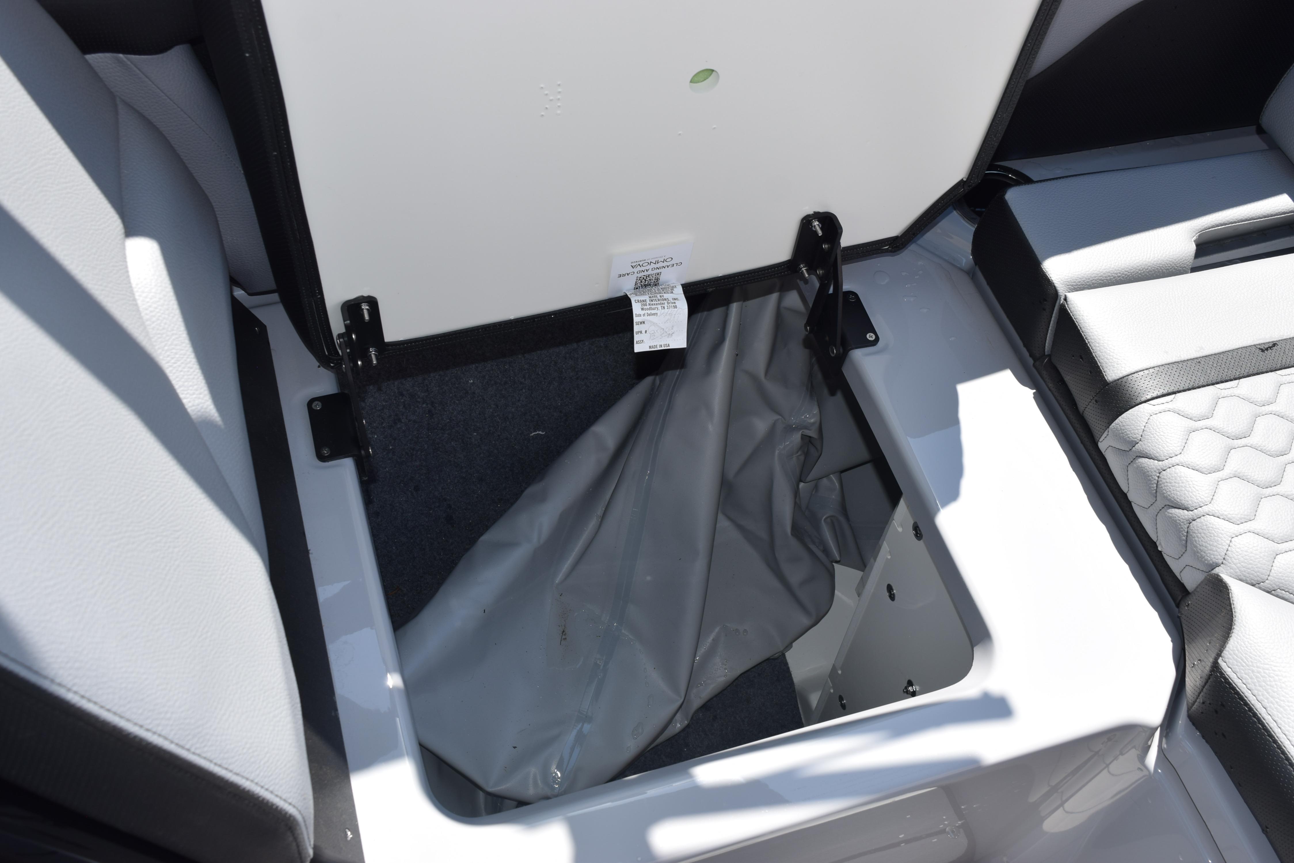 Yamaha Boats 255XD 2026 seat storage compartment open.