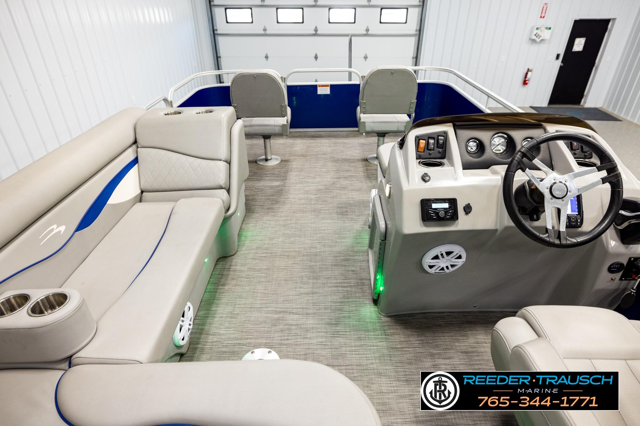 Interior of a 2021 Bennington 20 SV pontoon boat with modern seating and controls.