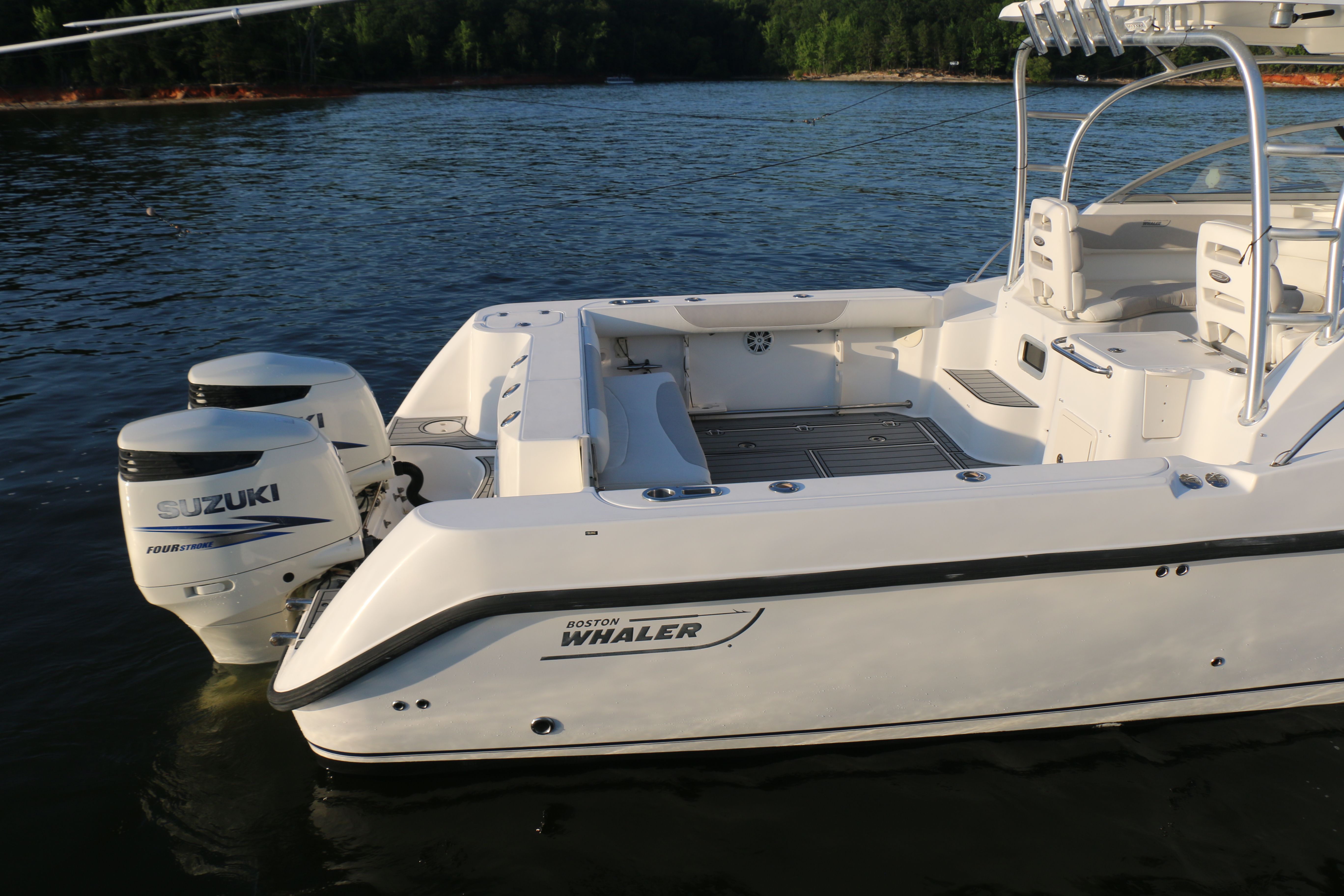 2006 Boston Whaler 305 Conquest on calm water.