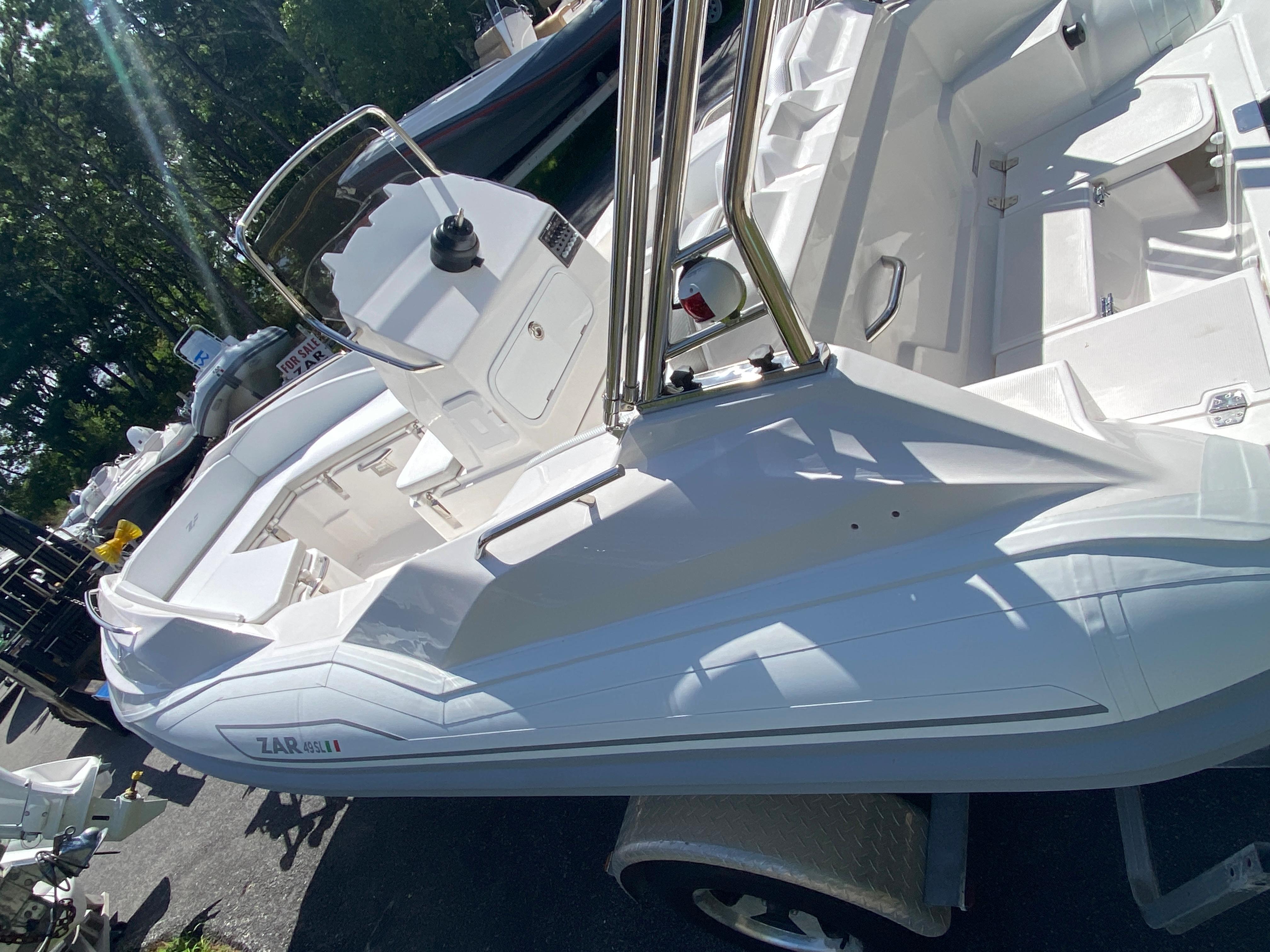 2024 Zar Formenti 49 SL inflatable boat in white, docked outdoors.