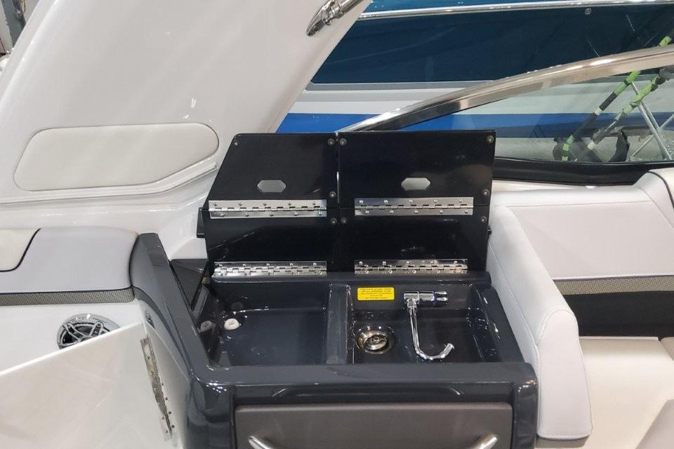 2026 Formula 310 Bowrider boat interior with open storage compartment and sleek design.