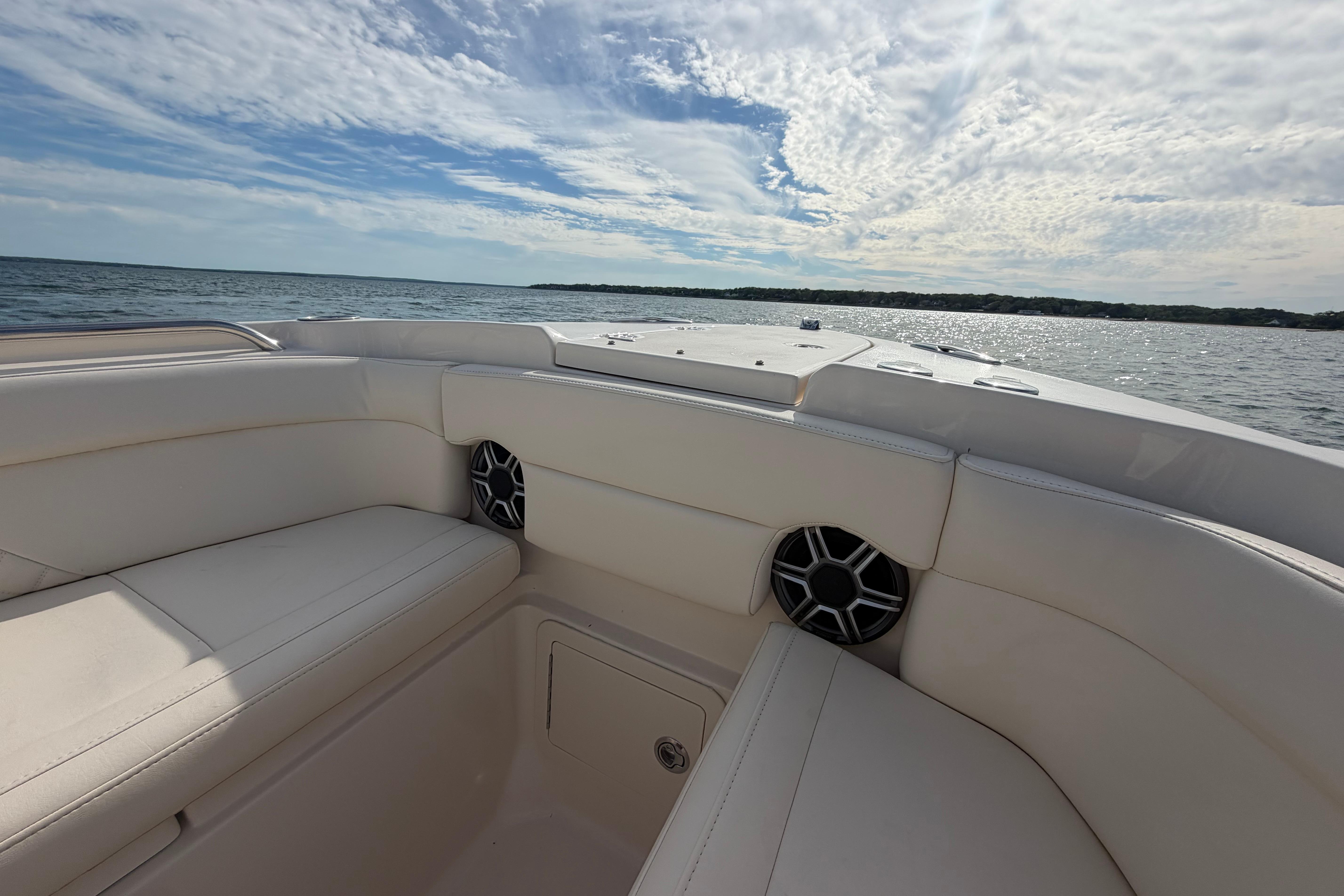 2026 Grady-White Freedom 275 boat interior with ocean view and clear sky.