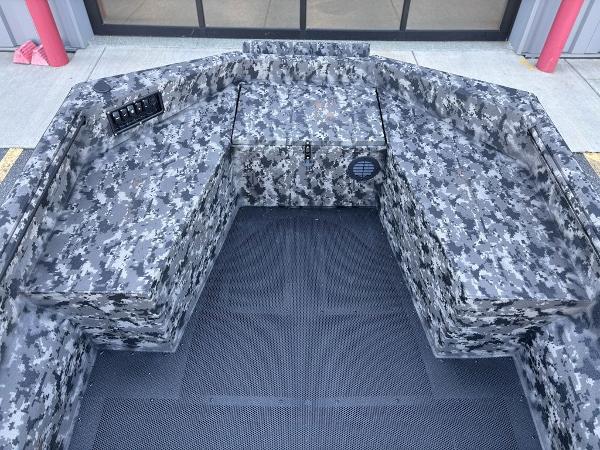 2025 Havoc 1656 VJST boat interior with camouflage seating and control panel.
