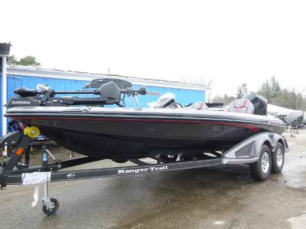 2025 Ranger Z519R Cup-Equipped boat on trailer, featuring Garmin equipment, parked outdoors.