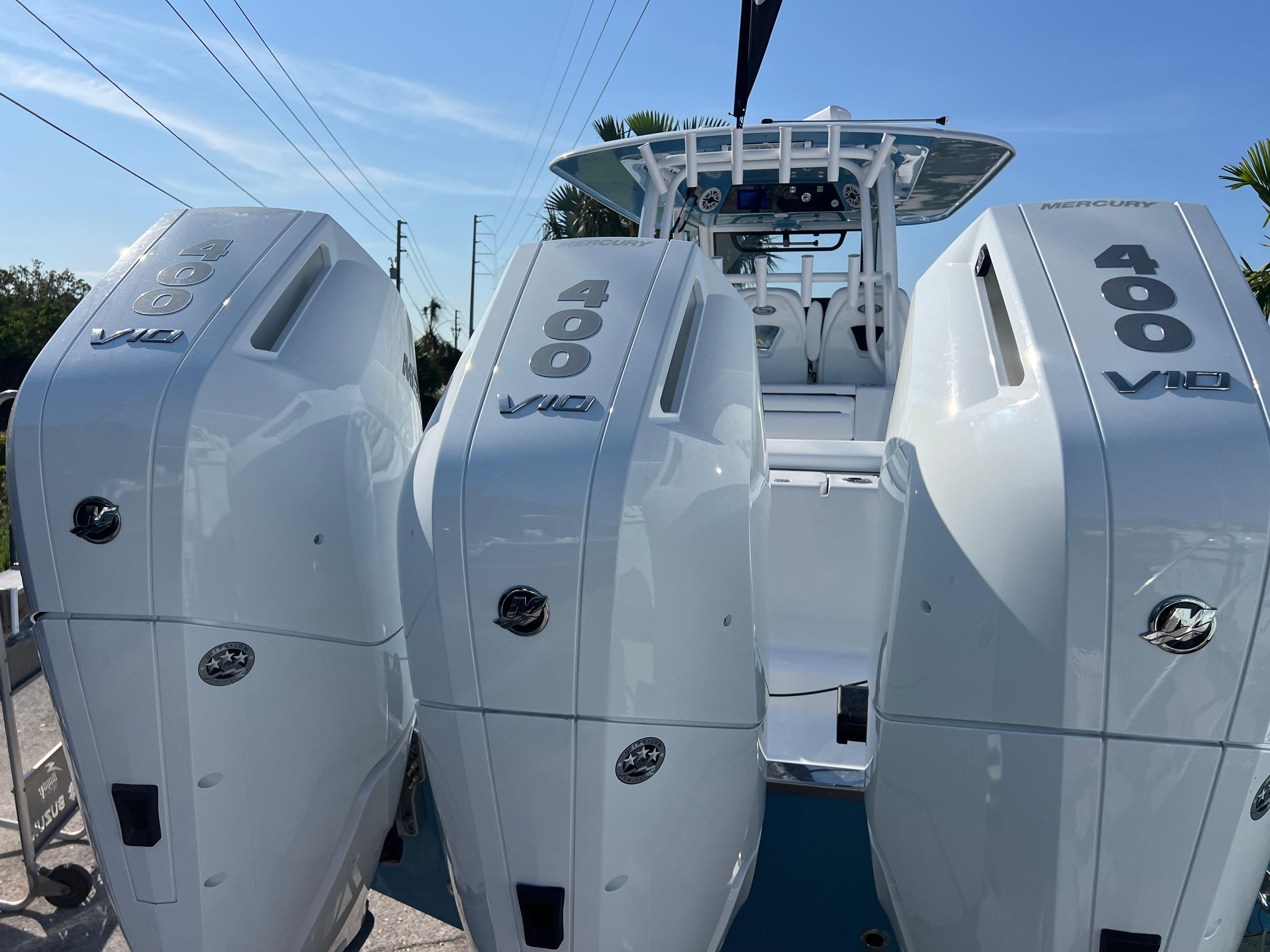 2025 Sportsman 352 Open with triple 400 V12 engines, showcasing powerful marine performance.