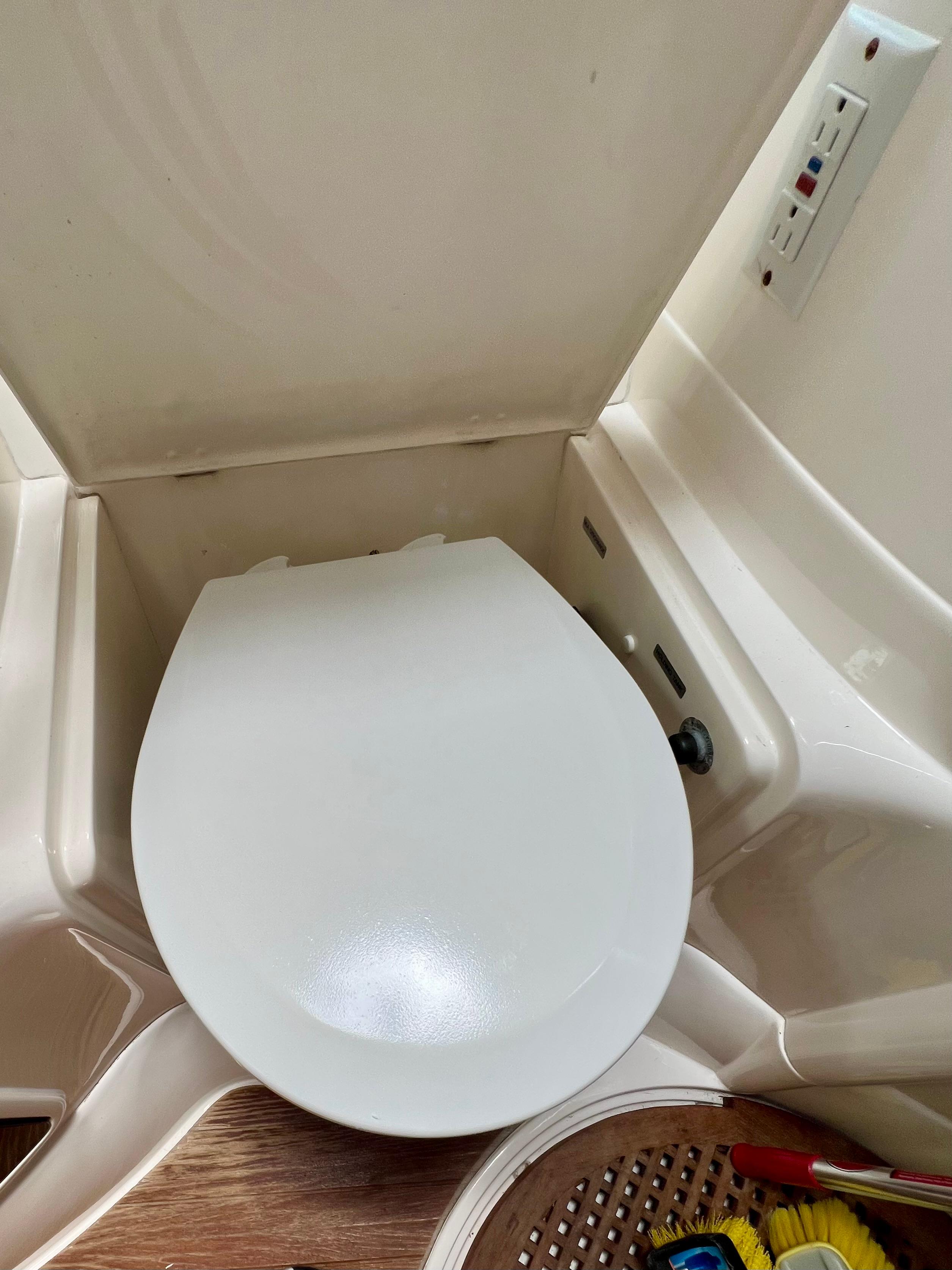 Toilet in 1999 Fairline Targa 48 Open yacht bathroom, featuring modern design and controls.