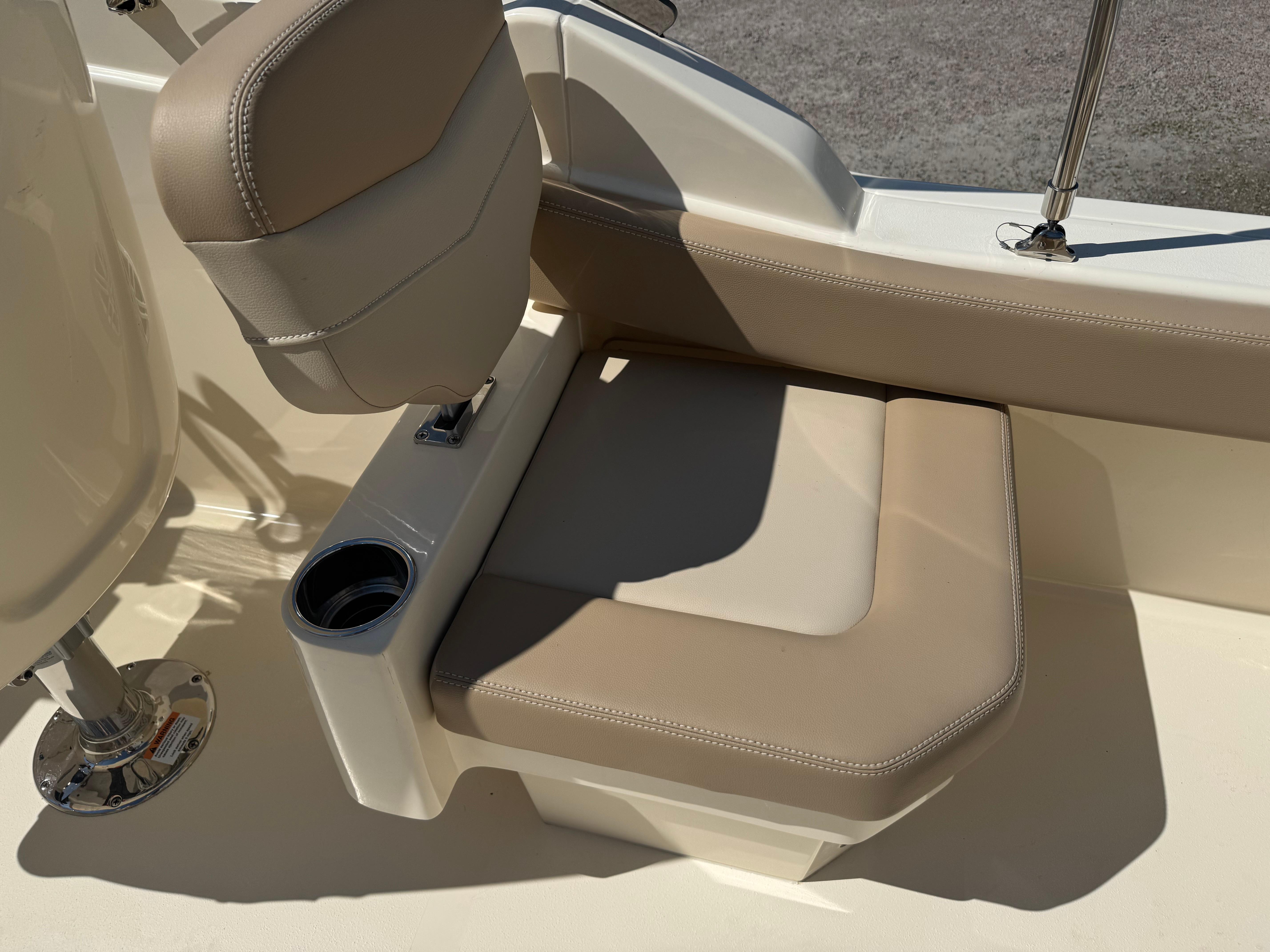 2025 Scout 215 Dorado boat seat with beige upholstery and integrated cup holder.