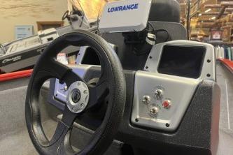 2026 Tracker Pro Team 175 boat dashboard with steering wheel and Lowrance electronics.
