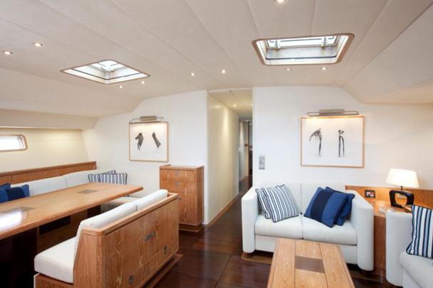 Luxurious yacht interior with wooden furnishings, skylights, and modern decor, CNB 104, 2002 model.