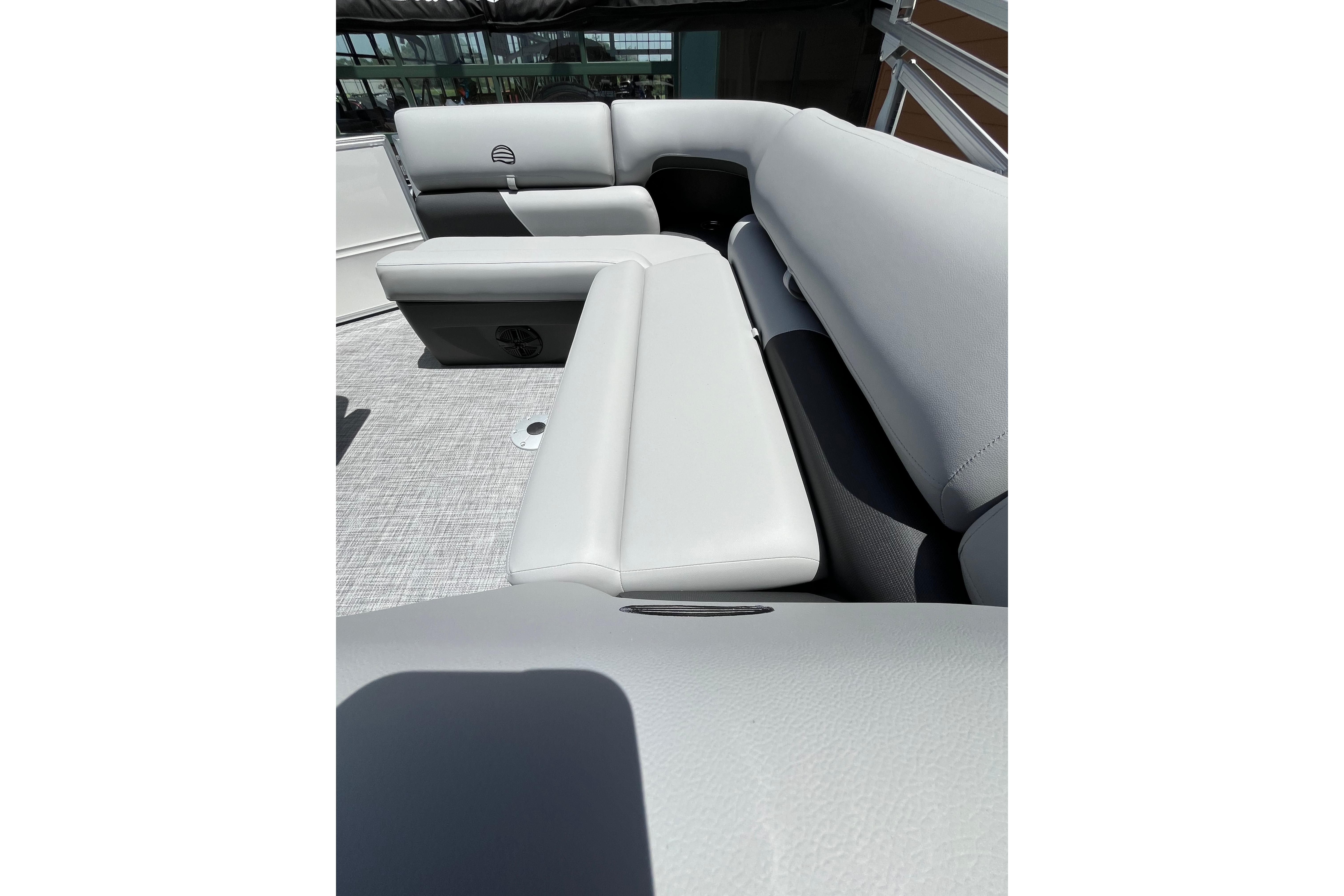 2026 Sun Tracker Party Barge 20 DLX interior seating with light gray upholstery.