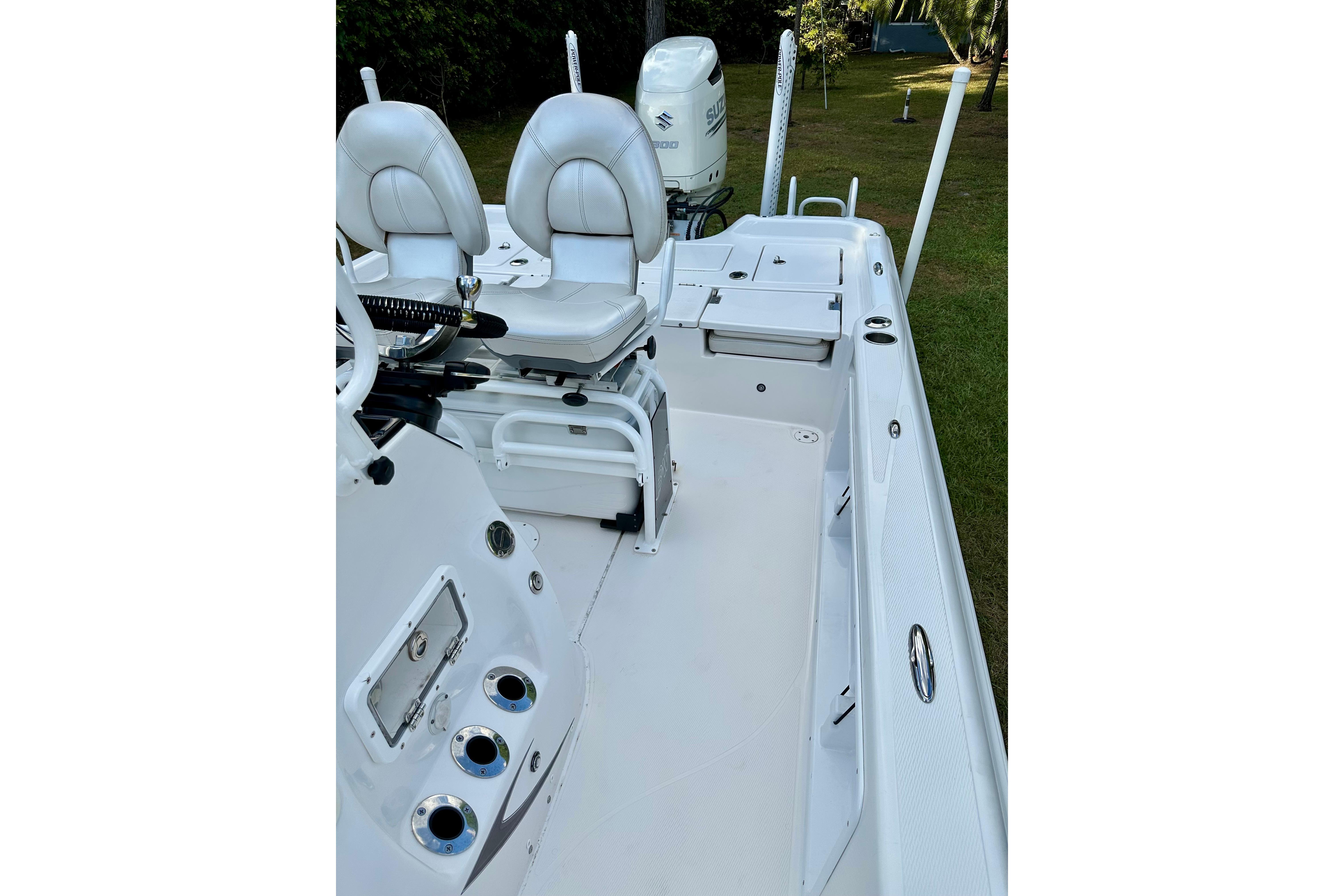 2017 Blue Wave 2400 PureBay boat interior with white seating and deck.
