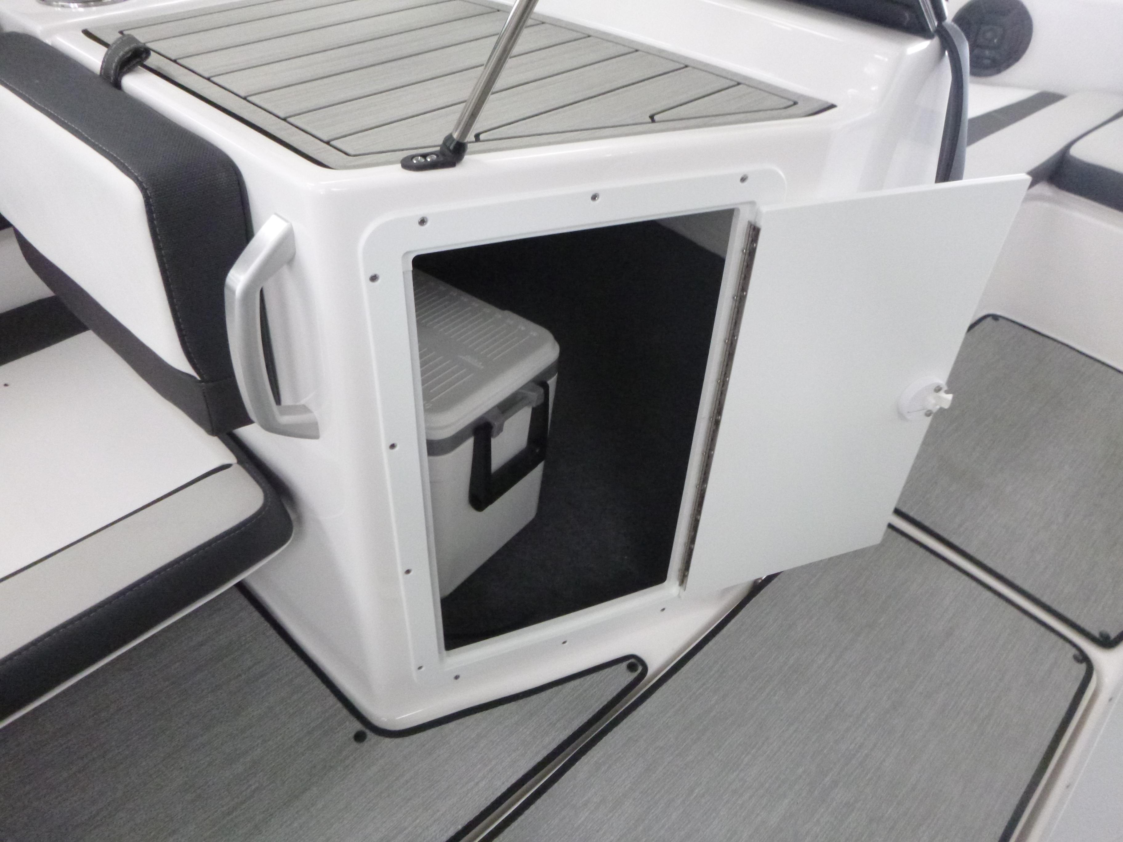 2025 Yamaha AR195 boat storage compartment with cooler inside.