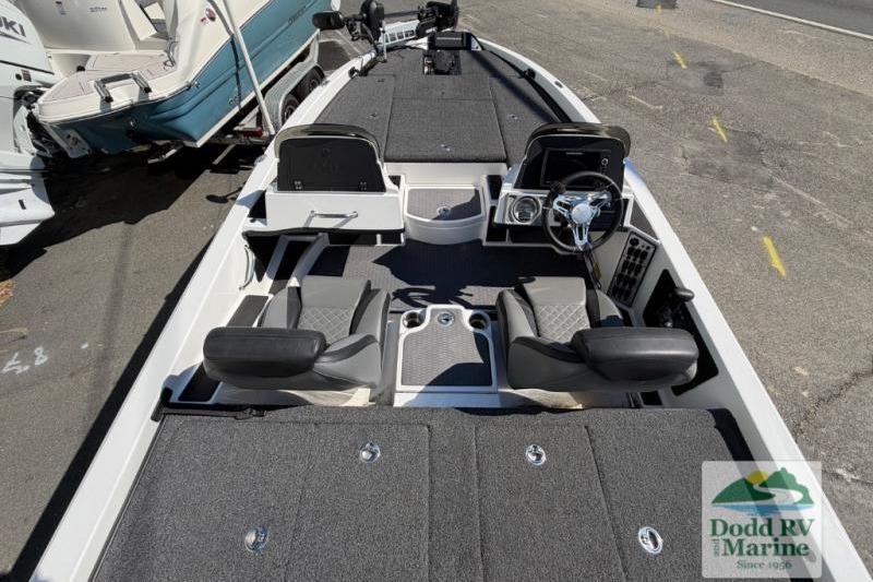2021 Caymas CX 18 SS boat interior with dual seats and steering console.