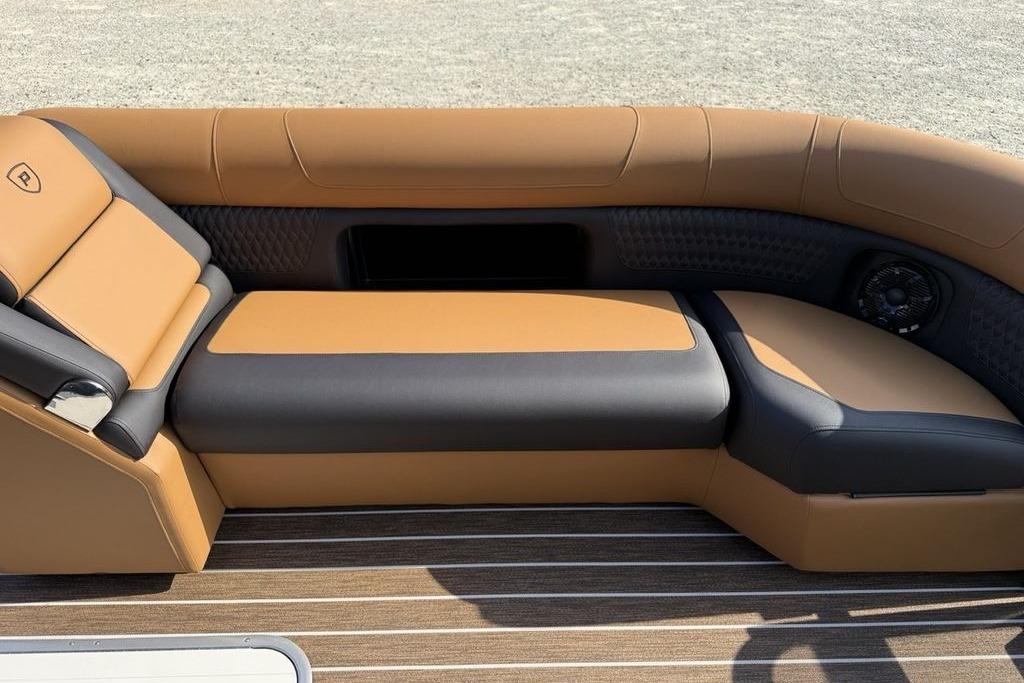 Luxurious seating on 2026 Premier 250 Solaris RS CL boat, featuring tan and black upholstery.